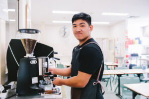 Student using a coffee machine