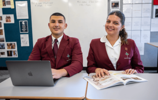 A photo of two students from Holy Spirit Catholic College Lakemba enjoying study and on their journey to 2025 NAPLAN success